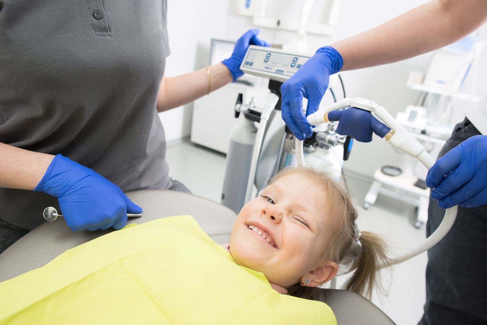 A cheerful child sitting in a dental chair