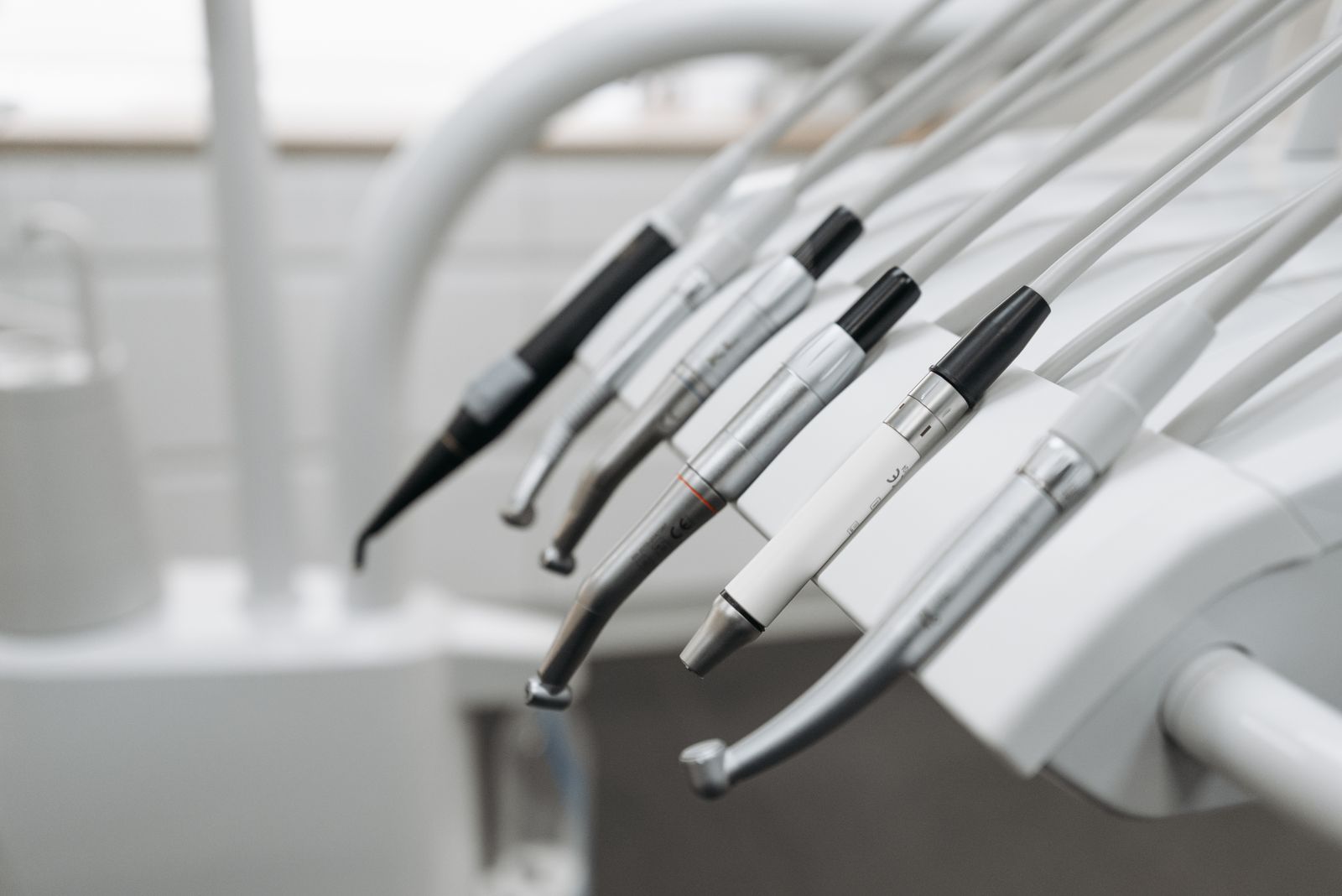 Dental instruments held neatly in a chairside holder